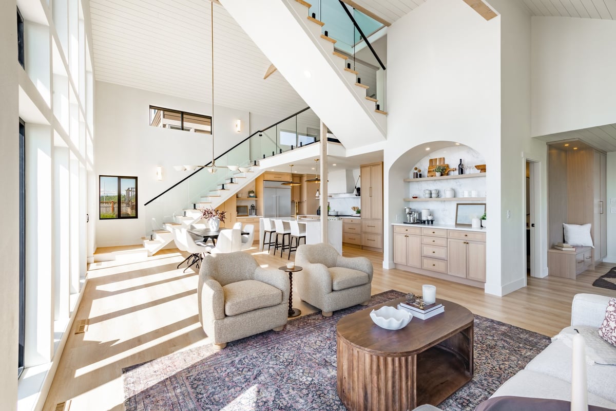 Interior of an oceanfront home with floor-to-ceiling windows and vaulted ceilings